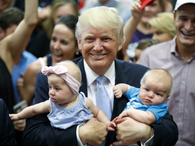 Building Wealth. Not so much. Trump Accounts are a bust for most families unlike other Baby Bonds proposals. Here, Trump is seen with babies on the 2016 campaign trail.