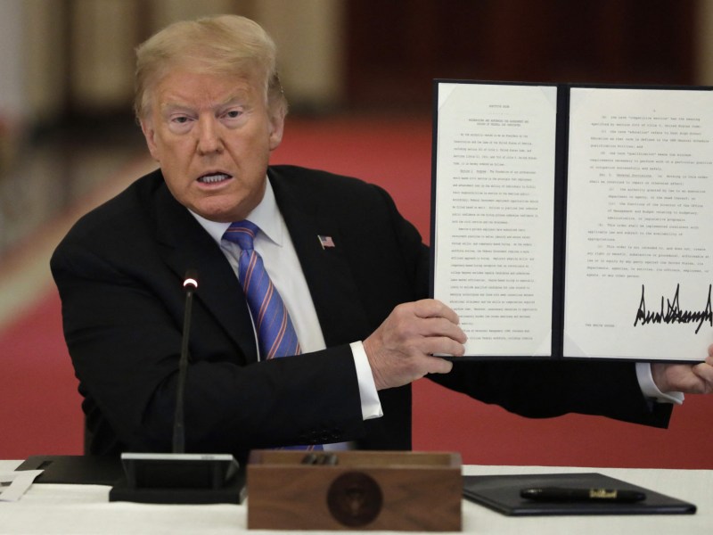 Photo of President Trump at the White House signing an executive order that could dramatically expand apprenticeship opportunities.