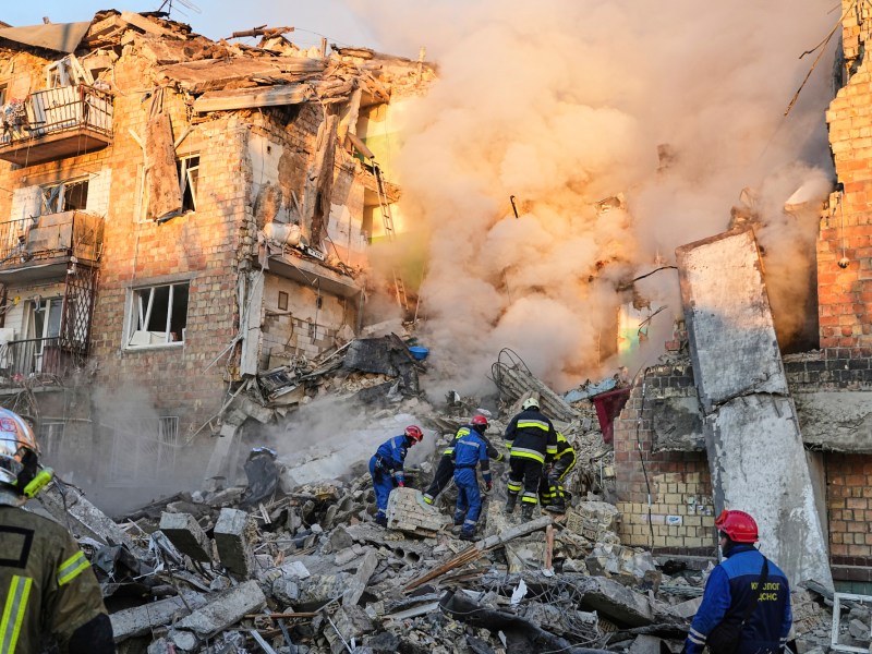 Firefighters work on the site of a burning building after a Russian attack in Kyiv, Ukraine, early Thursday, Aug. 28, 2025. (AP Photo/Efrem Lukatsky)